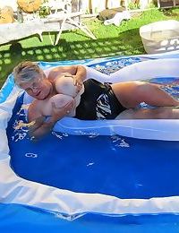 Fatty mature granny Girdle Goddess peels to enjoy wading pool skinny dip