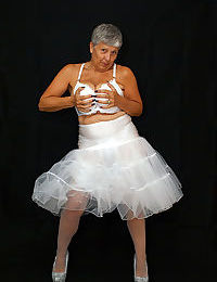 Brazen plump granny Savana flashes panty upskirt in tutu & sparkly high heels